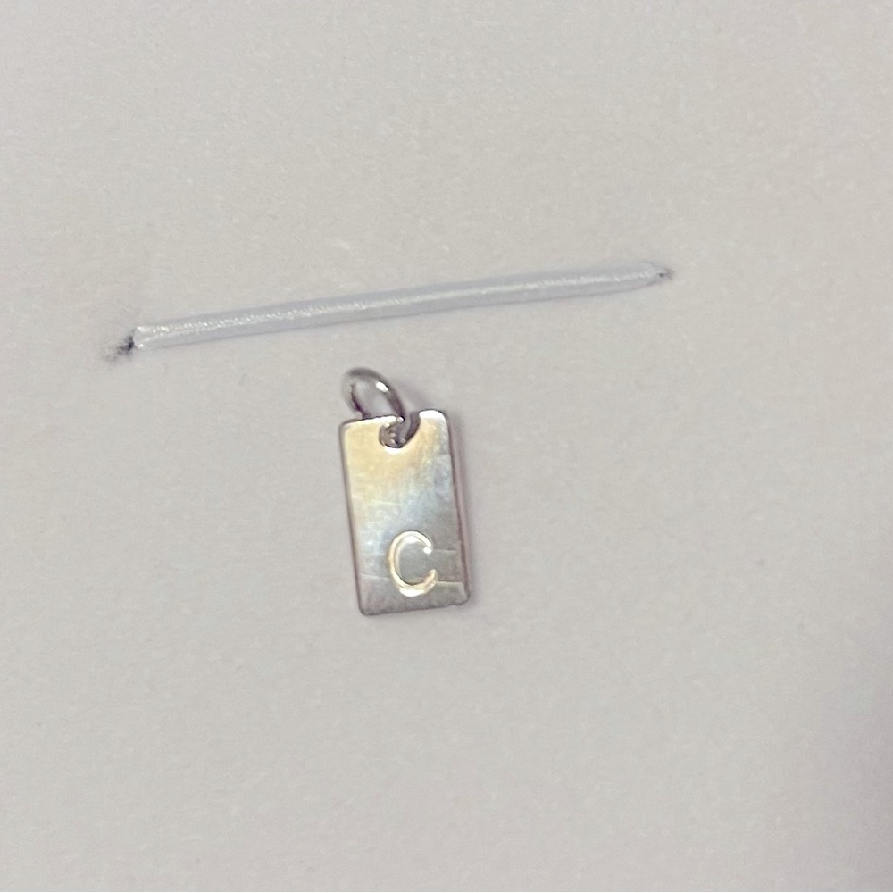 Initial Charm “C”